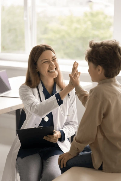 vertical-shot-cheerful-female-pediatrician-600nw-2375011957